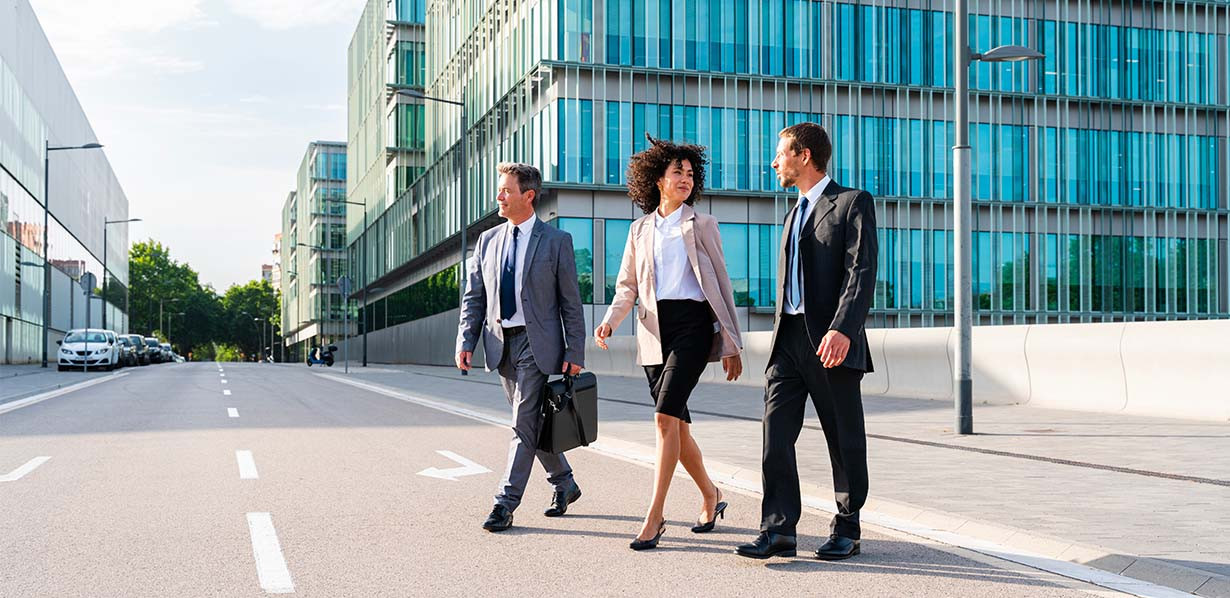 3 people walking on the street