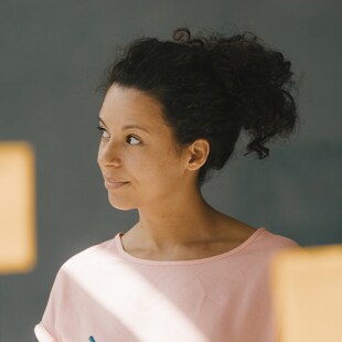 Woman brainstorming in office using adhesive notes