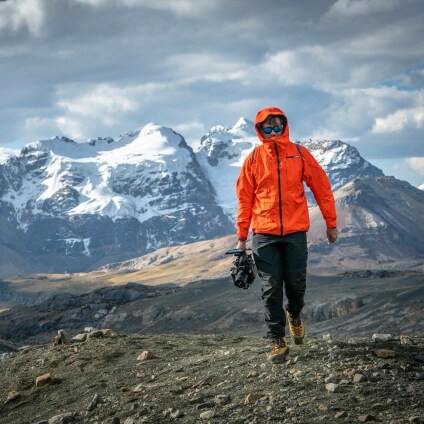 Craig Leeson with camera on mountain