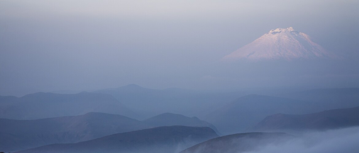 The summit of Cotopaxi volcano (5900 m) covered in snow in Ecuador