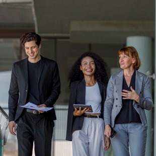 Businessmen and businesswoman chatting talk with tablet and document paper