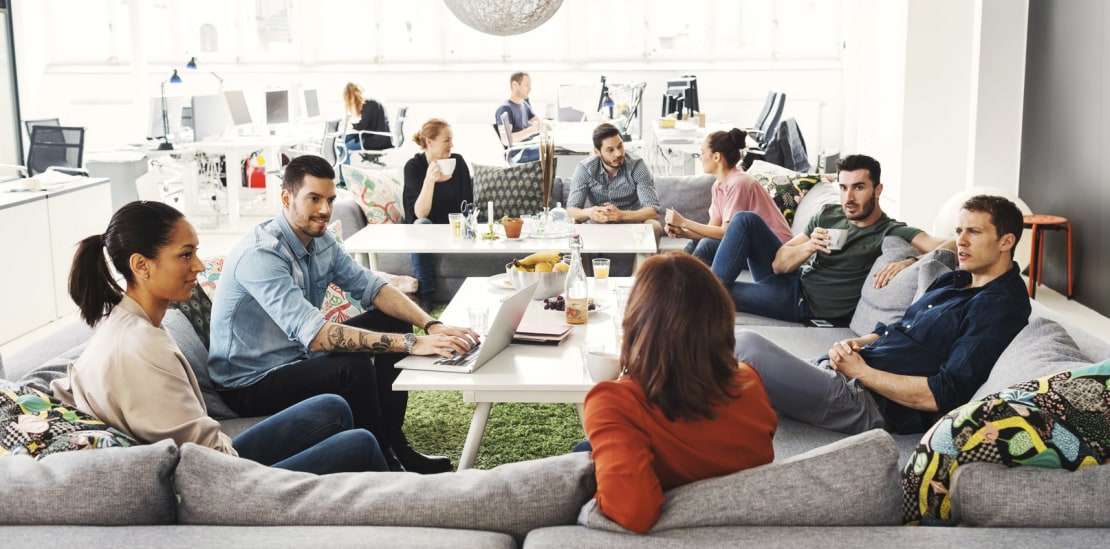 Group of people discussing in creative office