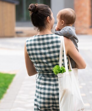 Young mother with baby son walking