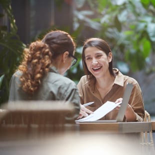 Meeting at work between two women