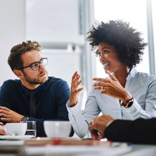 Shot of a group of businesspeople sitting together in a meeting