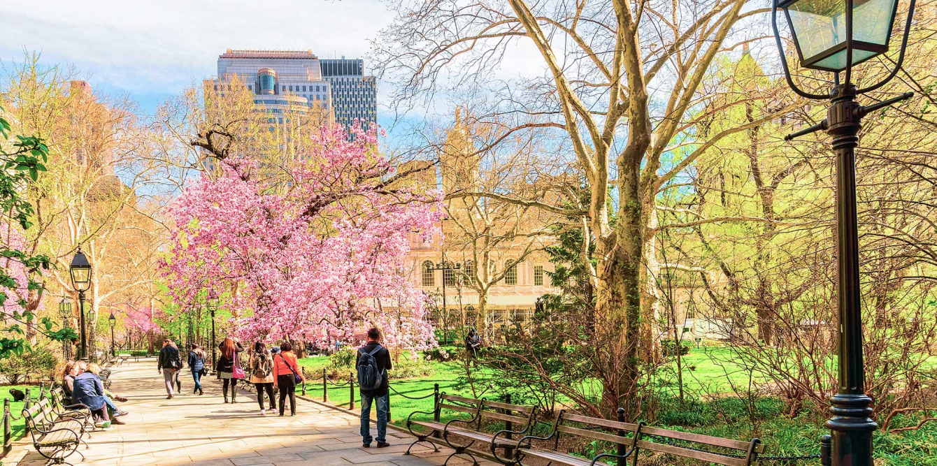 Tourists in City Hall Park of Lower Manhattan