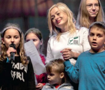Young people speaking at a meeting
